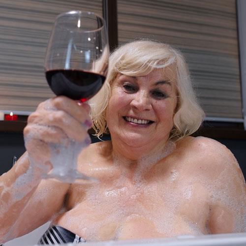 granny in bath with vino