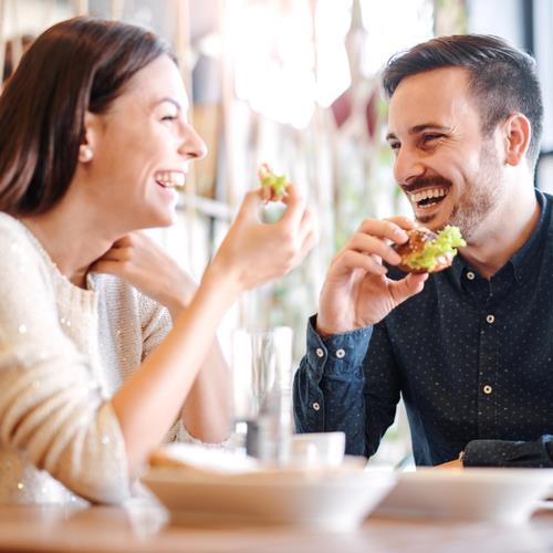 happy couple eating out