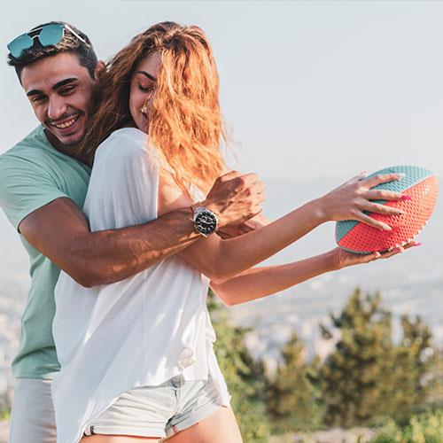 couple playing with football