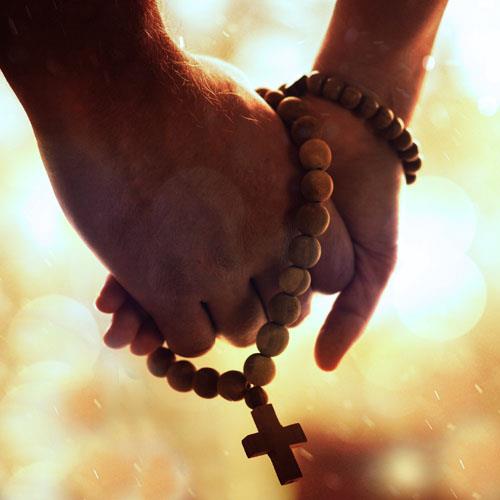 Christian couple holding hands