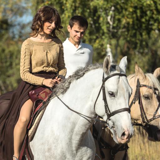 Couple on date riding horses