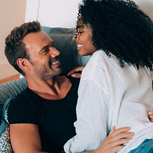 couple hooking up on sofa