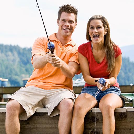 angler couple having fun fishing