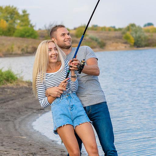 young couple on fishing date, outdoor dating